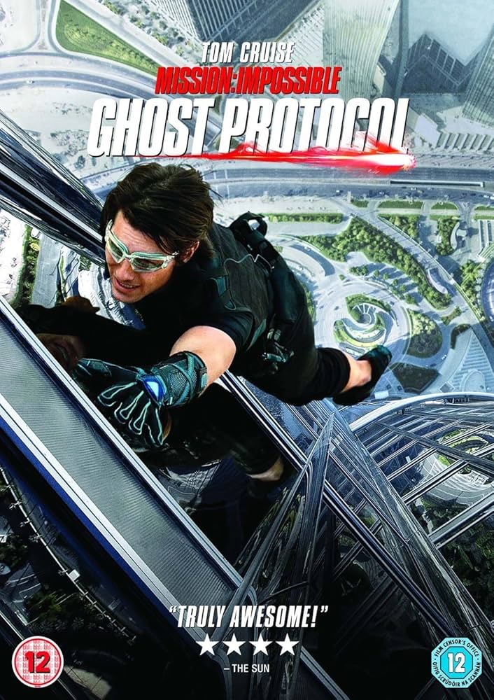 Tom Cruise climbing through a window in Mission: Impossible 4 during a cyber intrusion scene